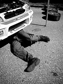 Mechanic lying on the ground.