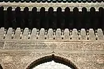 Details of the wood-carving along the top of the walls in the courtyard