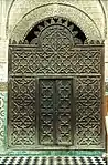 Wooden mashrabiya screen at the entrance of the courtyard