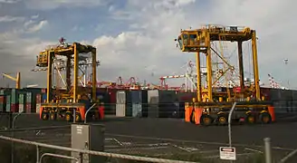 Straddle carriers in operation at the Port of Melbourne, Australia