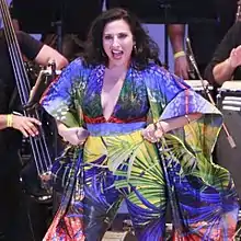 Almodovar performing with salsa orchestra at Hollywood Salsa Festival, 2018.