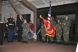 Members of the Mojave Vipers Young Marines present the colors and sing the national anthem.