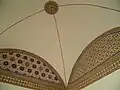 Painted decoration around a vaulted ceiling