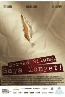 A poster, showing an elongated tear. The words "Mereka Bilang, Saya Monyet!" are stenciled below.