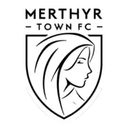 The words "Merthyr Town FC" are in the top of a pennant, with an illustration of Tydfil is at the bottom