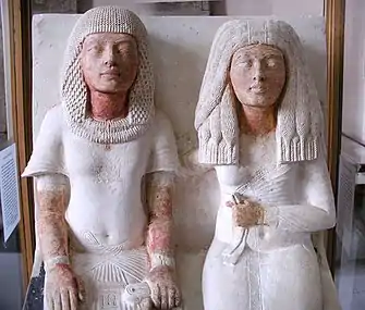 Meryre, a Scribe, and his wife(hieroglyph on his pants, w/ his name)