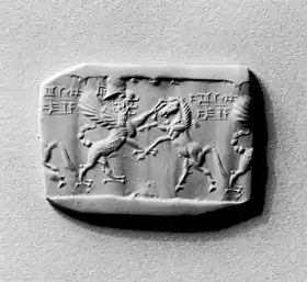 Cylinder seal usage of the i sign (part of ia (cuneiform))(had to be inscribed in-reverse to appear in clay impression correctly).