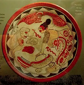 Mayan dish depicting the use of a metate to grind cocoa beans. Chocolate Museum, Bruges.