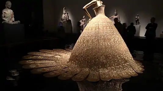 A silk couture dress by Chinese designer Guo Pei became a center piece of the exhibition