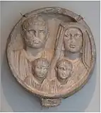 Roman funerary relief from 2nd–3rd century showing a couple and their kids