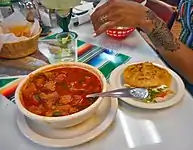 Mondongo (menudo) soup and gordita