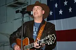Michael Peterson performing aboard USS Theodore Roosevelt, December 2005