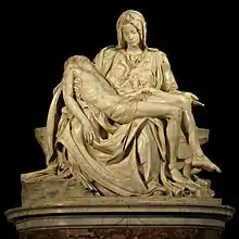 A sculpture of a woman cradling a dead man