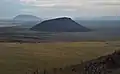 Middle Butte (center) and Big Southern Butte (upper left) rise above the Snake River Plain as seen from East Butte