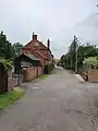 Middle Holme Lane, Sutton-on-Trent. (Houses and a small road are visible)