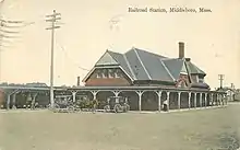 A postcard showing a Tudor-style railroad station