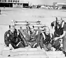 Loading concrete training bombs on aircraft