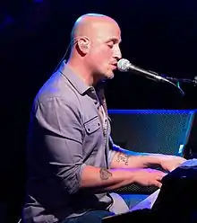 DelGuidice playing piano and vocals