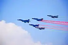 Mikoyan MiG-29 & Chengdu F-7 of Bangladesh Air Force fly over national parade ground