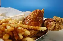 Fried chicken and french fries with mild sauce