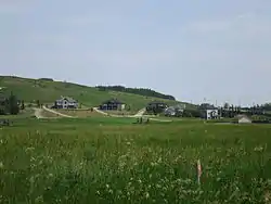 The eastern part of the hamlet of Millarville, looking ENE from Highway 549. Highways 22 is visible near the right edge of the image.