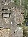 Re-used stones in the gable end wall