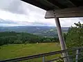 View south, over the edge of the plateau and towards the Cantal mountains, from the Mont Bessou viewing tower.