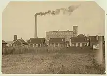An image capturing the housing conditions for iron mill workers during the industrial era.