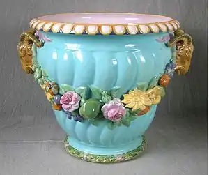 Coloured lead glazes majolica, flowers moulded in high relief. Shape first shown at the 1851 Exhibition by Minton & Co., Exhibit Number 60.