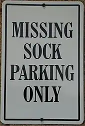 parking sign with the text "MISSING SOCK PARKING ONLY"