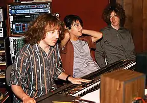 Mitch Easter sitting at a mixing board next to Michael Quercio and Scott Miller