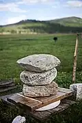 Three large stones removing excess liquid from a cheese, Khövsgöl Province