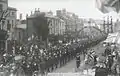 Monnow Street in July 1919, showing a procession of servicemen and civilians to celebrate peace after the First World War