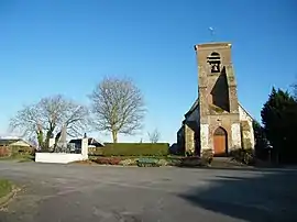 The war memorial and church in Saigneville