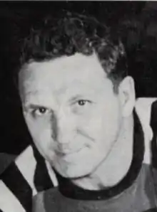 Black and white photo of Lallo in a hockey uniform and equipment