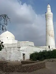 White minaret and mosque.
