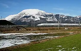The Shinkansen streaks past Mount Ibuki before reaching Maibara Station.