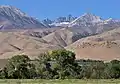 The view from Big Pine. Mount Jepson and Mount Sill centered in the distance with snow lingering below the summits.