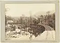 John Watt Beattie (c.1900) Mount Lyell railway showing train on King River Bridge