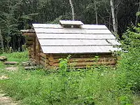 A timber cutter's mountain log cabin at the Museum of Folk Architecture, Pyrohiv, Ukraine.