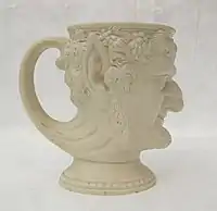Mug moulded as satyr's head, caneware (?)