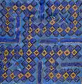 Tile from a 14th-century mausoleum in Uzbekistan, inscribed with Muhammad's name (محمد) in square Kufic; one of a set used to frame a doorway