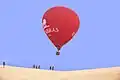 Hot Air Balloon over white sand dunes