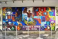 Picture of a mural featuring multiple elements related to the National Polytechnic Institute, including multiple logos of faculties, American football players and a person waving a flag.