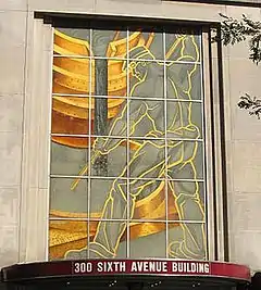 The Puddler, a glass mural of an iron or steel worker in downtown Pittsburgh
