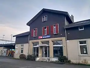 Three-story building with gabled roof