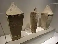 Various ancient carved limestone burial urns