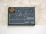 Plaque commemorating the building's importance during the Warsaw Uprising
