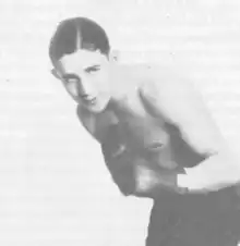 A young Mushy Callahan shown in a boxing stance.