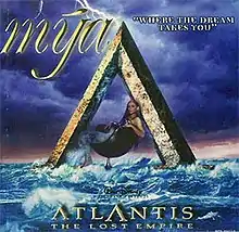 singer Mýa on the single cover for "Where the Dream Takes You" seated atop the "A" for "Atlantis".